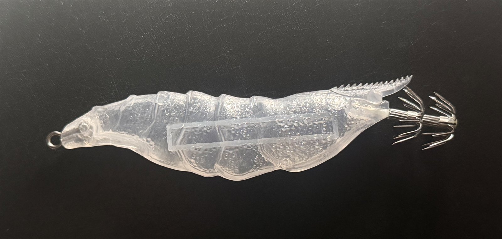 Unpainted textured ABS Tafros shell showing the internal weight rail
