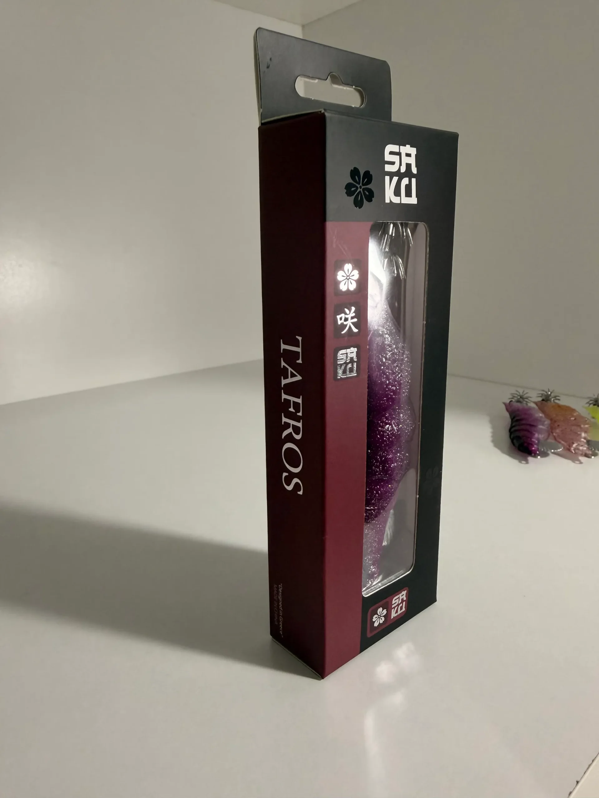 TAFROS retail box standing upright showing the Saku logo and the product window