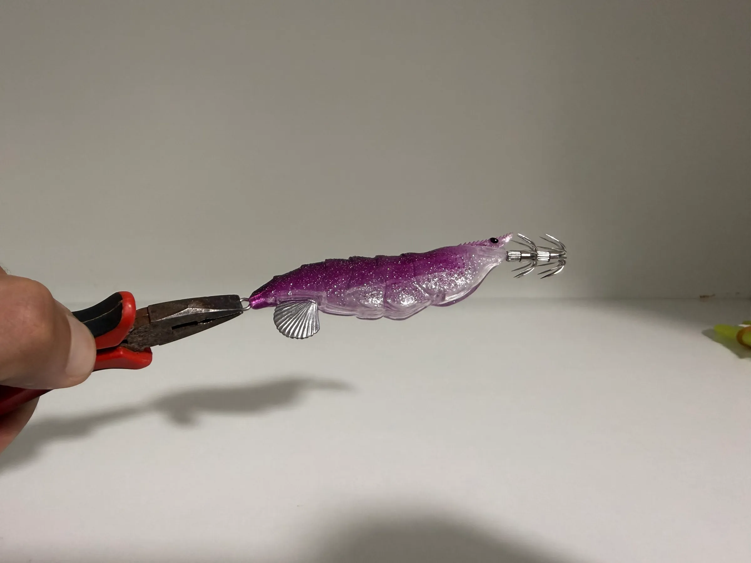 Violet TAFROS prototype held in pliers during workshop inspection